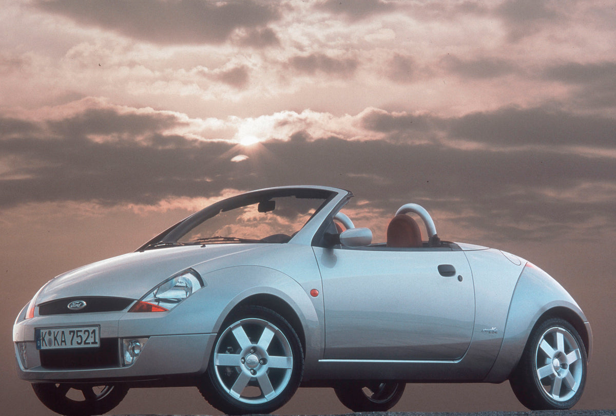 This archival image documents the 2003 Ford Street Ka with scenic cloudy sky and is preserved in the Ford Heritage Vault as part of Ford Motor Company's historic photographic archive. Free for personal, non-commercial use. Ford Heritage Vault refe...