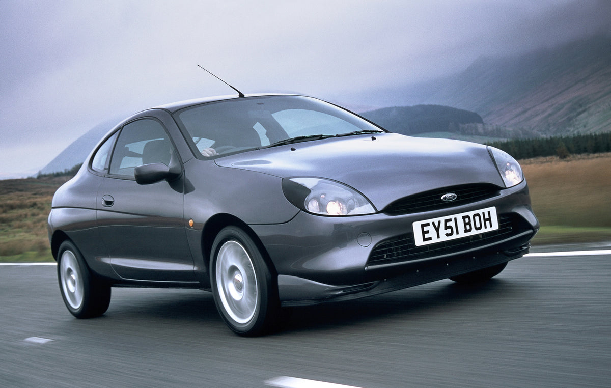 This archival image documents the 2001 Ford Puma Thunder action shot on scenic road and is preserved in the Ford Heritage Vault as part of Ford Motor Company's historic photographic archive. Free for personal, non-commercial use. Ford Heritage Vau...