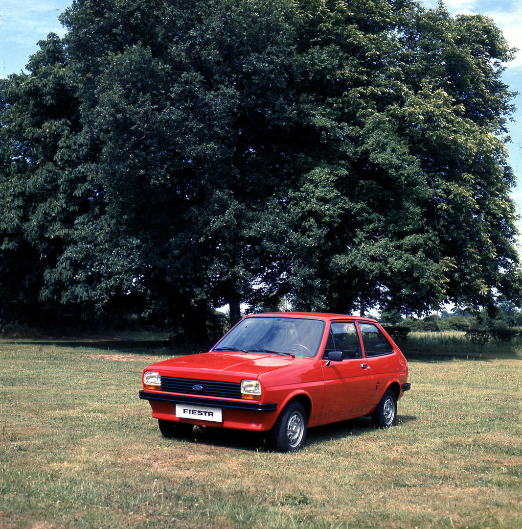 This archival image documents the 1976 Ford Fiesta Mark I with scenic trees and is preserved in the Ford Heritage Vault as part of Ford Motor Company's historic photographic archive. Free for personal, non-commercial use. Ford Heritage Vault refer...