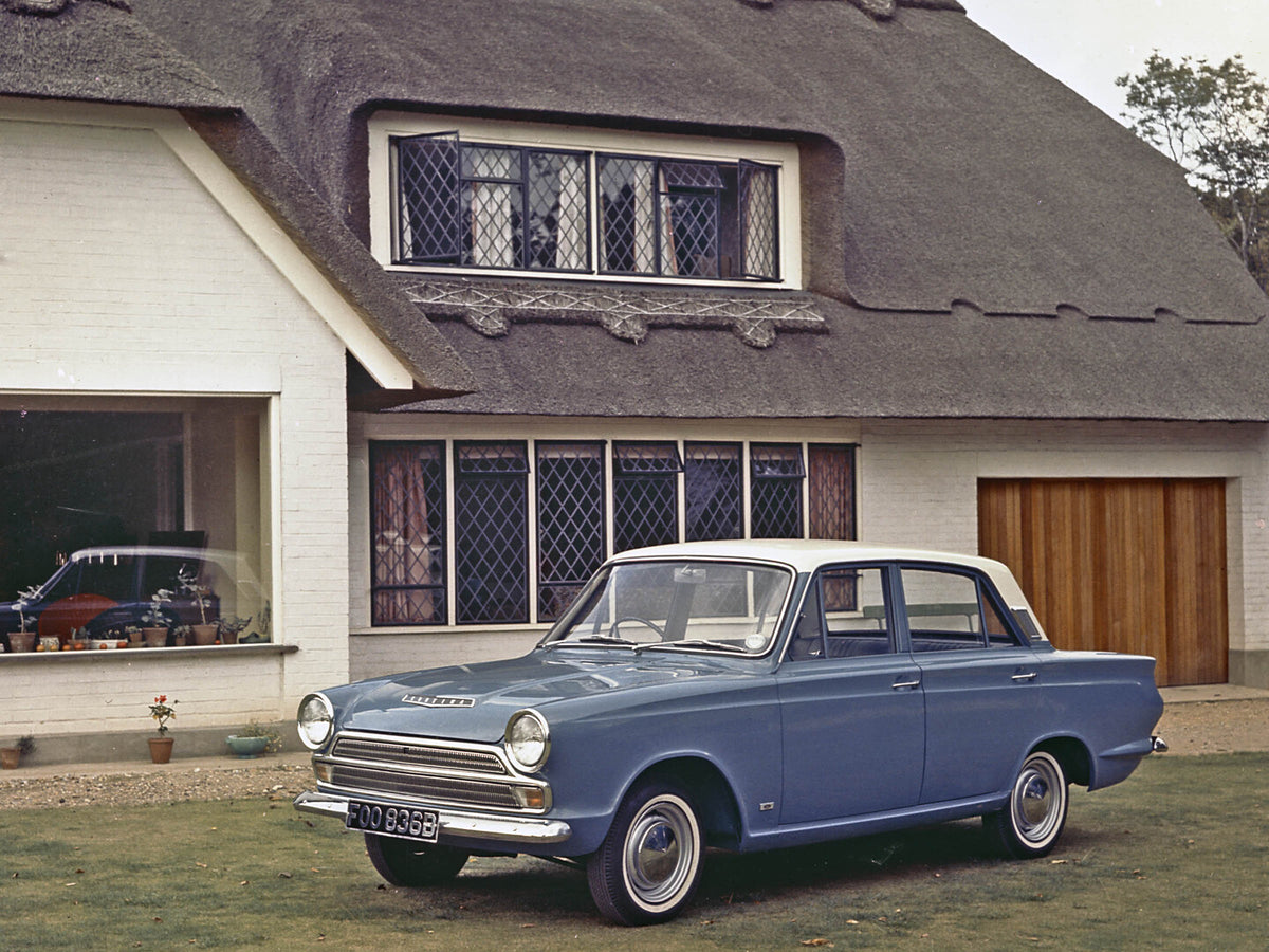 This archival image documents the 1964 Ford Cortina MKI side view in front of house 1964-1375 and is preserved in the Ford Heritage Vault as part of Ford Motor Company's historic photographic archive. Free for personal, non-commercial use. Ford He...