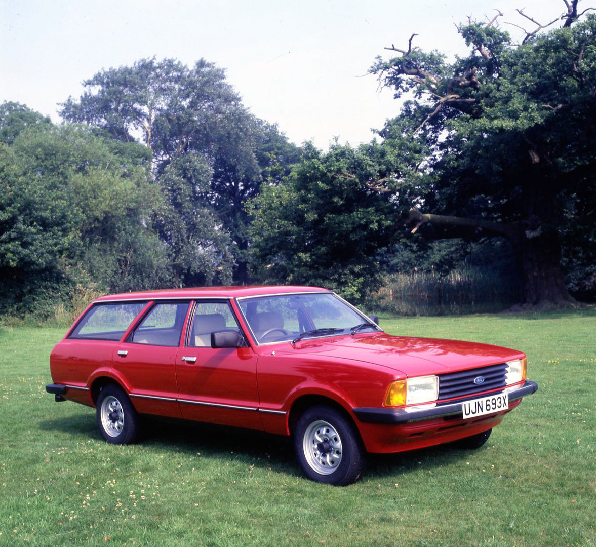 This archival image documents the 1981 Ford Cortina Estate 1.6L in scenic field with trees and is preserved in the Ford Heritage Vault as part of Ford Motor Company's historic photographic archive. Free for personal, non-commercial use. Ford Herit...