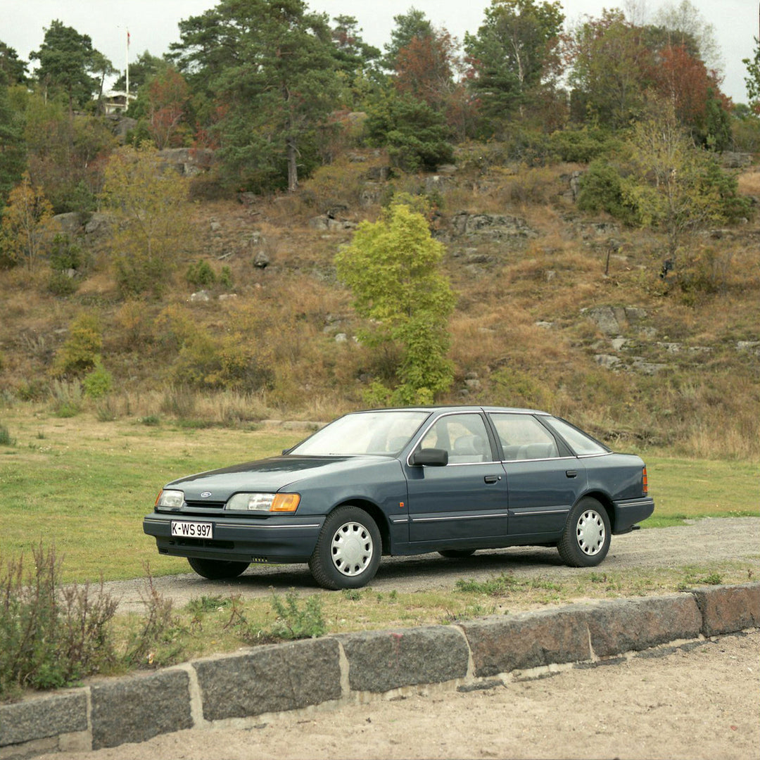 This archival image documents the 1984 Ford Scorpio Mark I GL LHD on scenic road with trees in Norway and is preserved in the Ford Heritage Vault as part of Ford Motor Company's historic photographic archive. Free for personal, non-commercial use....
