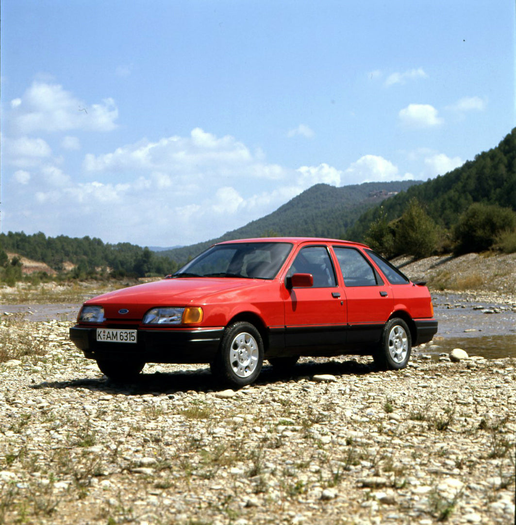 This archival image documents the 1986 Heritage Archive - 1987 1/2 Ford Sierra side view on scenic riverbank in Spain and is preserved in the Ford Heritage Vault as part of Ford Motor Company's historic photographic archive. Free for personal, non...