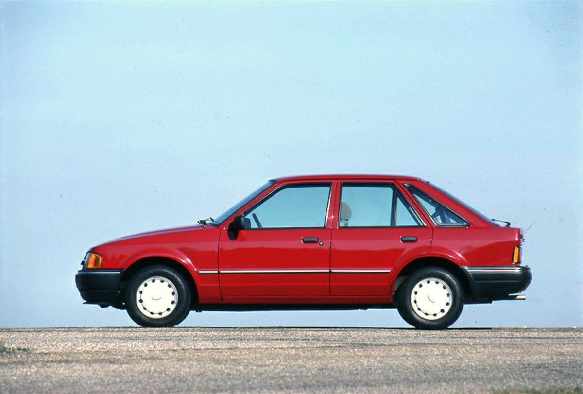 This archival image documents the 1989 Heritage Archive - 1988 Ford Escort Mark IV side view with scenic blue sky and is preserved in the Ford Heritage Vault as part of Ford Motor Company's historic photographic archive. Free for personal, non-com...