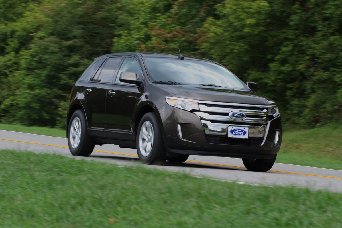 This archival image documents the 2010 Ford Edge action shot on road and is preserved in the Ford Heritage Vault as part of Ford Motor Company's historic photographic archive. Free for personal, non-commercial use. Ford Heritage Vault reference AR...