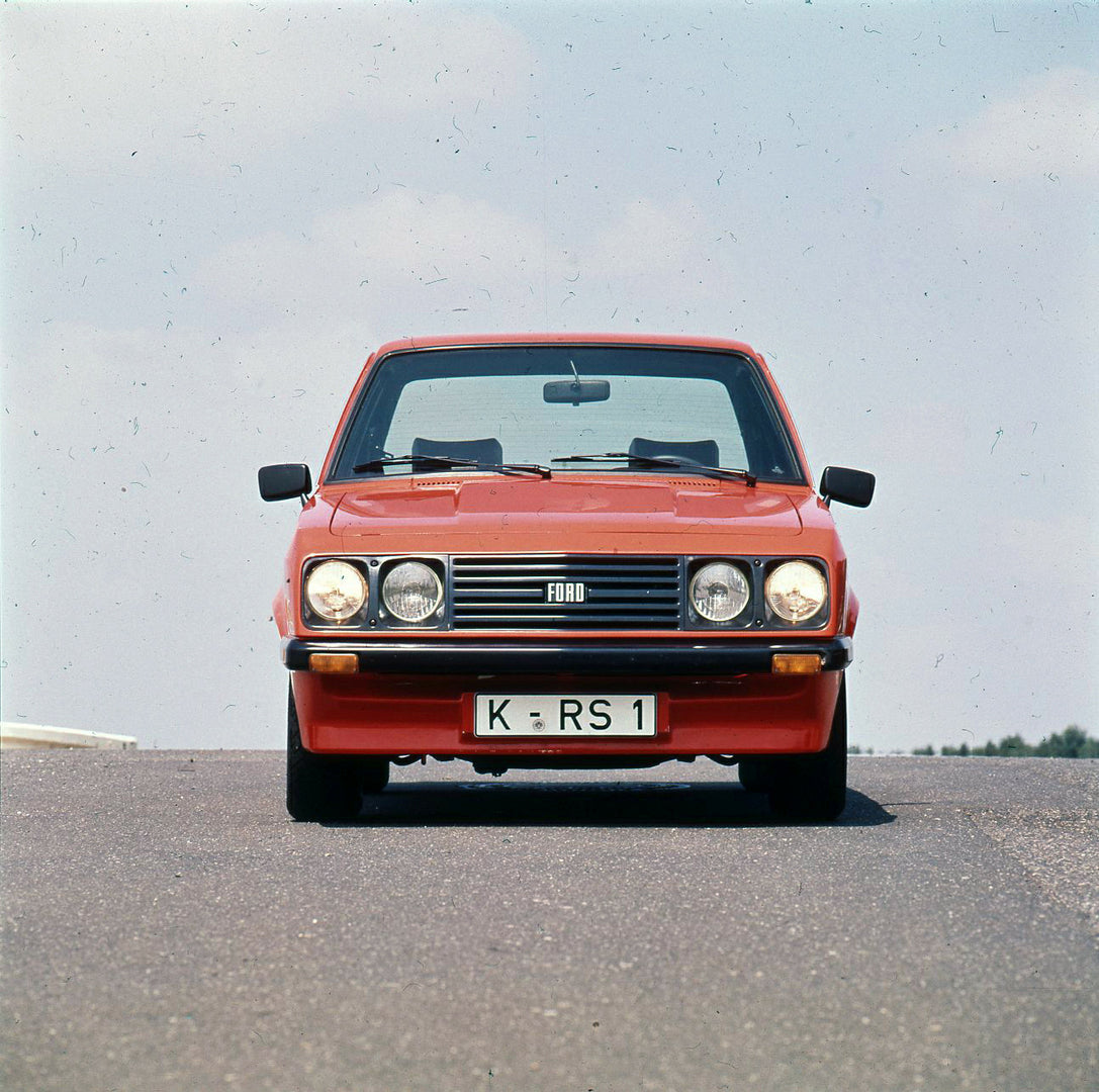 This archival image documents the 1975 Ford Escort Mark II RS 2000 front view with scenic sky and is preserved in the Ford Heritage Vault as part of Ford Motor Company's historic photographic archive. Free for personal, non-commercial use. Ford He...