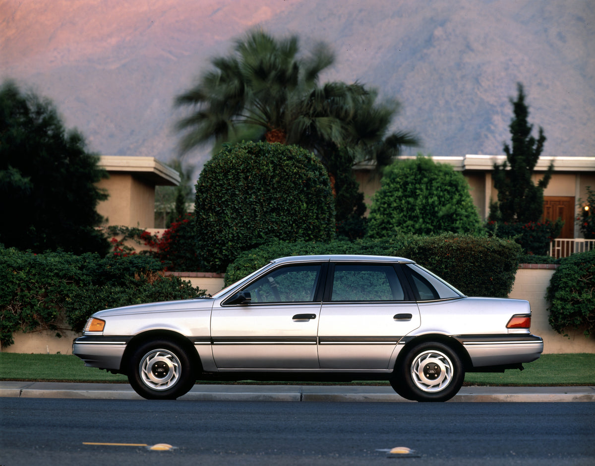 This archival image documents the 1988 Ford Tempo LX four-door and is preserved in the Ford Heritage Vault as part of Ford Motor Company's historic photographic archive. Free for personal, non-commercial use. Ford Heritage Vault reference AR-2008-...