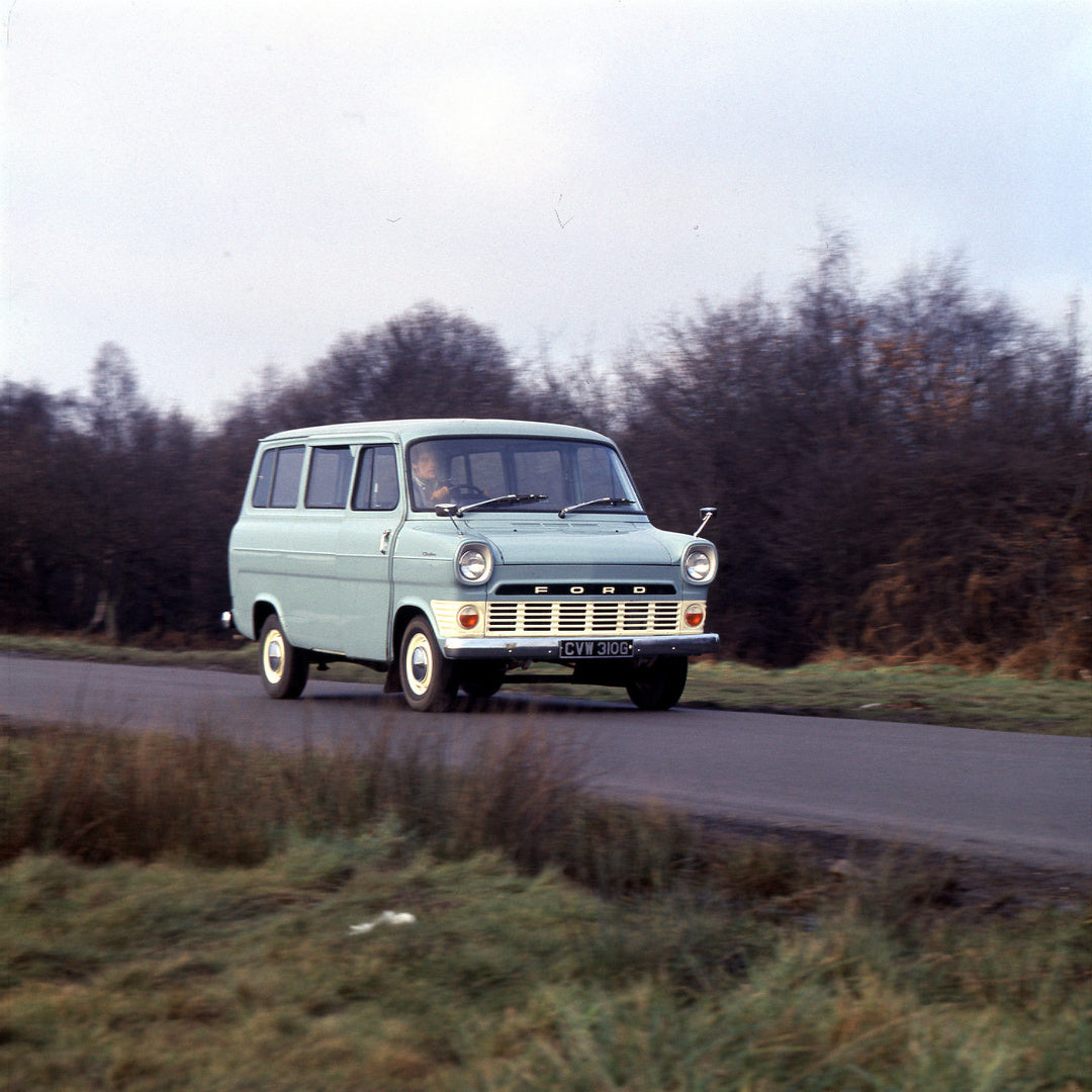 This archival image documents the 1969 Ford Transit Mark I Custom 12 Seater Bus action shot on scenic road and is preserved in the Ford Heritage Vault as part of Ford Motor Company's historic photographic archive. Free for personal, non-commercial...