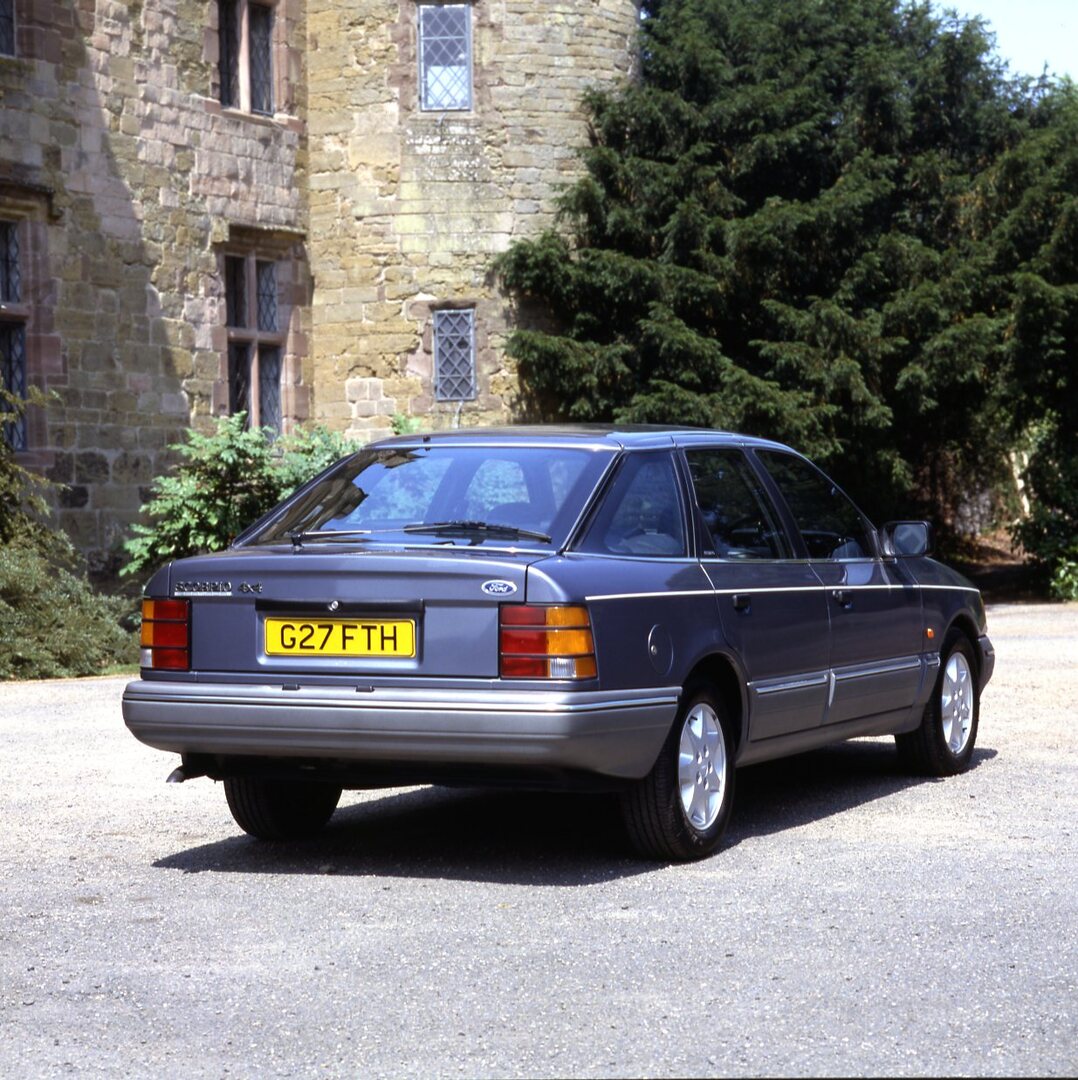 This archival image documents the 1989 Ford Granada Scorpio MK I 4x4 rear view at scenic castle and is preserved in the Ford Heritage Vault as part of Ford Motor Company's historic photographic archive. Free for personal, non-commercial use. Ford ...