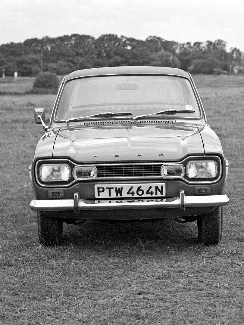 This archival image documents the 1974 Ford Escort 1300E front view 1974-928-10 and is preserved in the Ford Heritage Vault as part of Ford Motor Company's historic photographic archive. Free for personal, non-commercial use. Ford Heritage Vault r...