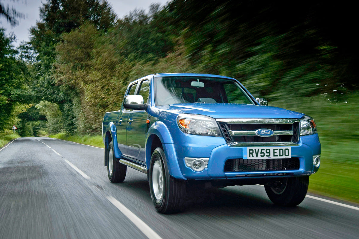 This archival image documents the 2009 Ford Ranger Thunder action shot on scenic road with trees and is preserved in the Ford Heritage Vault as part of Ford Motor Company's historic photographic archive. Free for personal, non-commercial use. Ford...