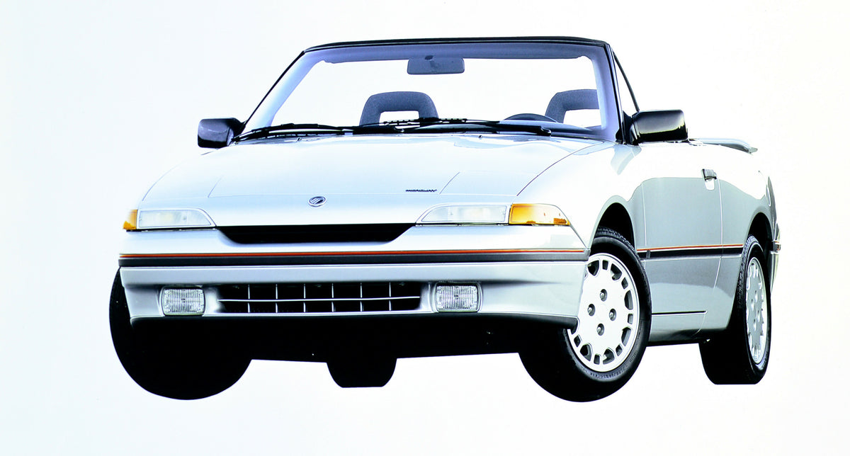 This archival image documents the 1992 Mercury Capri convertible and is preserved in the Ford Heritage Vault as part of Ford Motor Company's historic photographic archive. Free for personal, non-commercial use. Ford Heritage Vault reference AR-200...