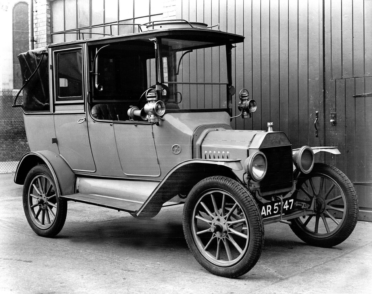 This archival image documents the 1912 Ford Model T fordor front 3/4 view and is preserved in the Ford Heritage Vault as part of Ford Motor Company's historic photographic archive. Free for personal, non-commercial use. Ford Heritage Vault referen...