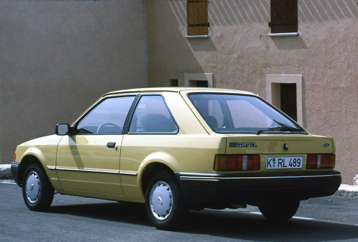 This archival image documents the 1986 Ford Escort Mark IV CL rear view in front of building and is preserved in the Ford Heritage Vault as part of Ford Motor Company's historic photographic archive. Free for personal, non-commercial use. Ford Her...