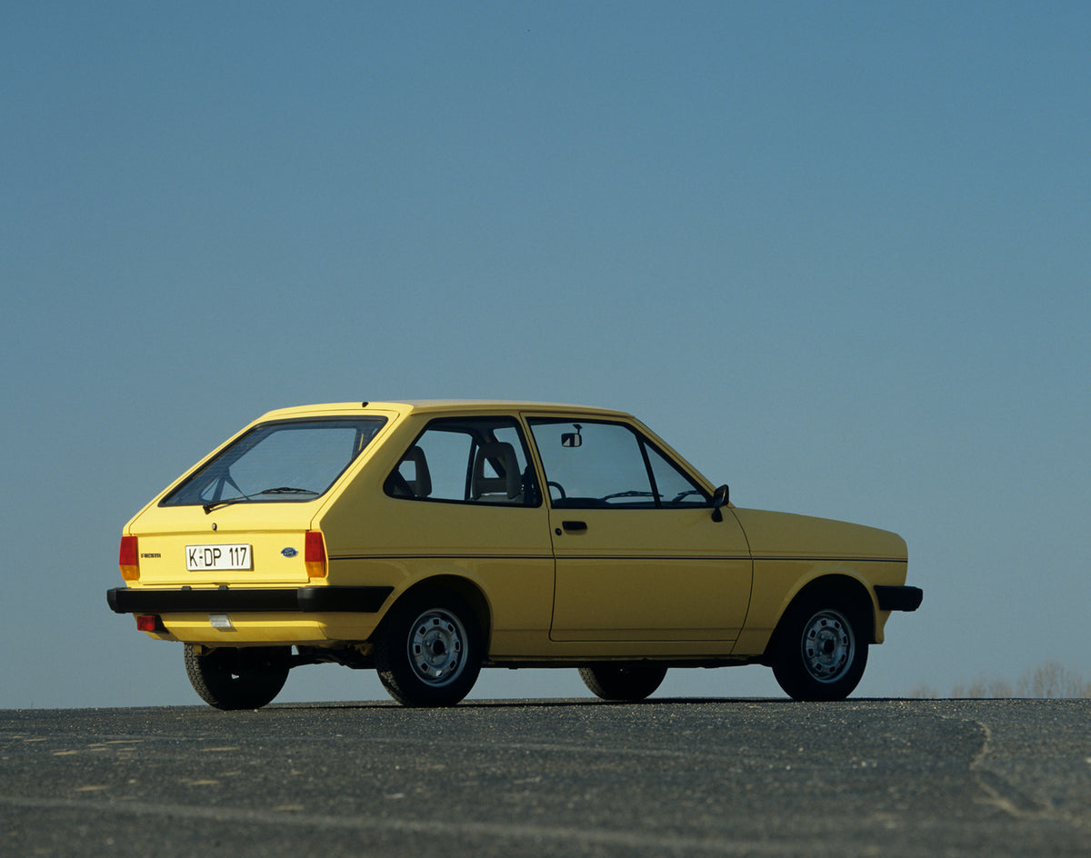 This archival image documents the 1982 Ford Fiesta Mark I rear view with scenic blue sky and is preserved in the Ford Heritage Vault as part of Ford Motor Company's historic photographic archive. Free for personal, non-commercial use. Ford Heritag...