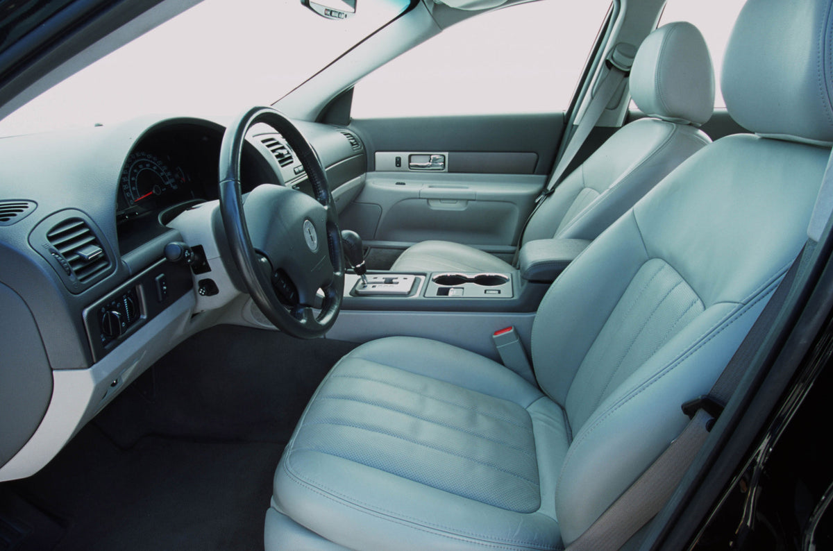 This archival image documents the 2004 Lincoln LS leather interior and is preserved in the Ford Heritage Vault as part of Ford Motor Company's historic photographic archive. Free for personal, non-commercial use. Ford Heritage Vault reference AR-2...