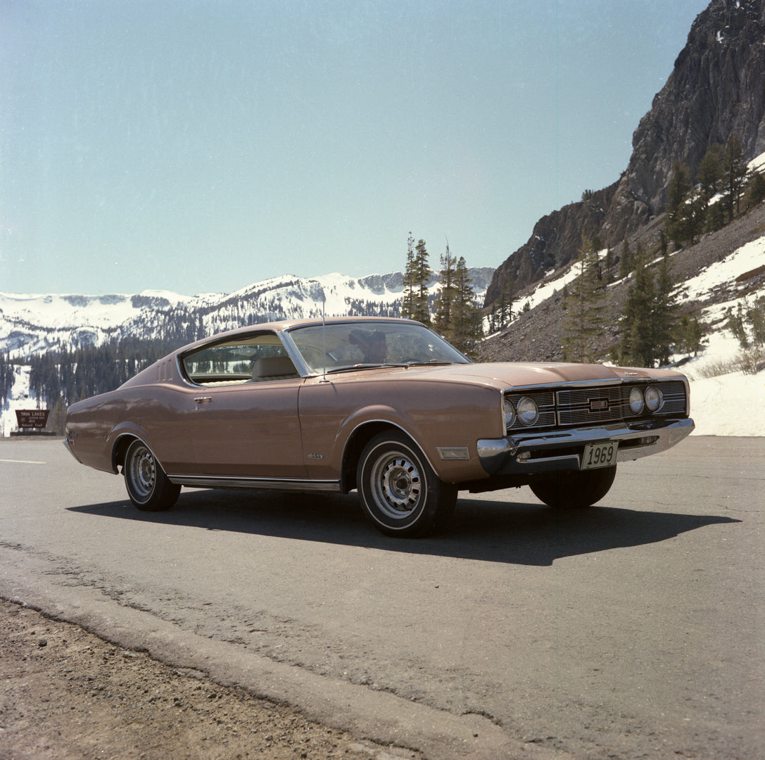This archival image documents the 1969 Mercury Cyclone sportsroof on Road with Snow and Mountains in Background and is preserved in the Ford Heritage Vault as part of Ford Motor Company's historic photographic archive. Free for personal, non-comme...