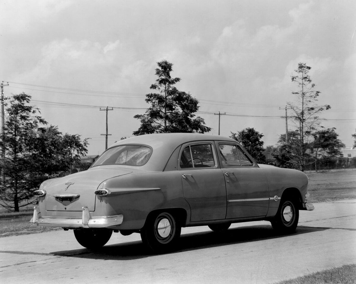 This archival image documents the 1951 Meteor Sedan rear view on scenic road with trees AR-2007-5 and is preserved in the Ford Heritage Vault as part of Ford Motor Company's historic photographic archive. Free for personal, non-commercial use. For...