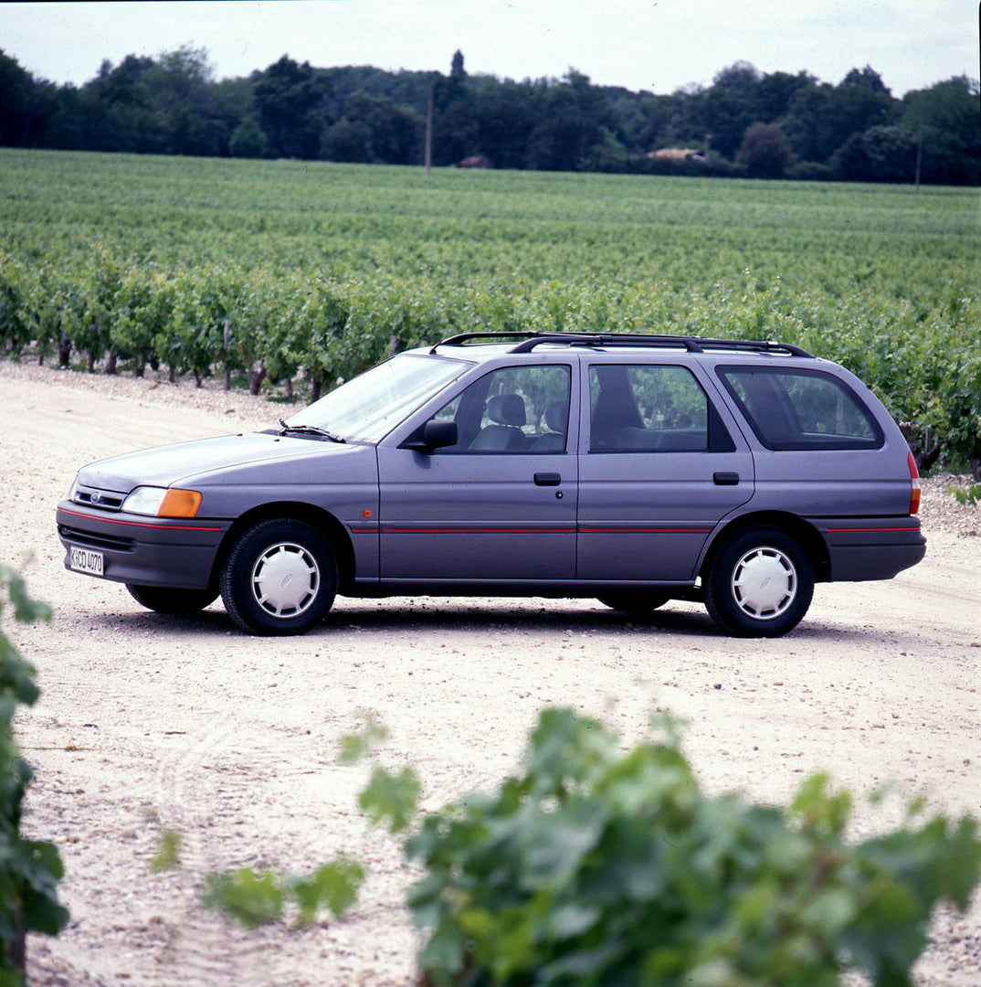 This archival image documents the 1990 Ford Escort Mark IV Estate side view in scenic field and is preserved in the Ford Heritage Vault as part of Ford Motor Company's historic photographic archive. Free for personal, non-commercial use. Ford Heri...
