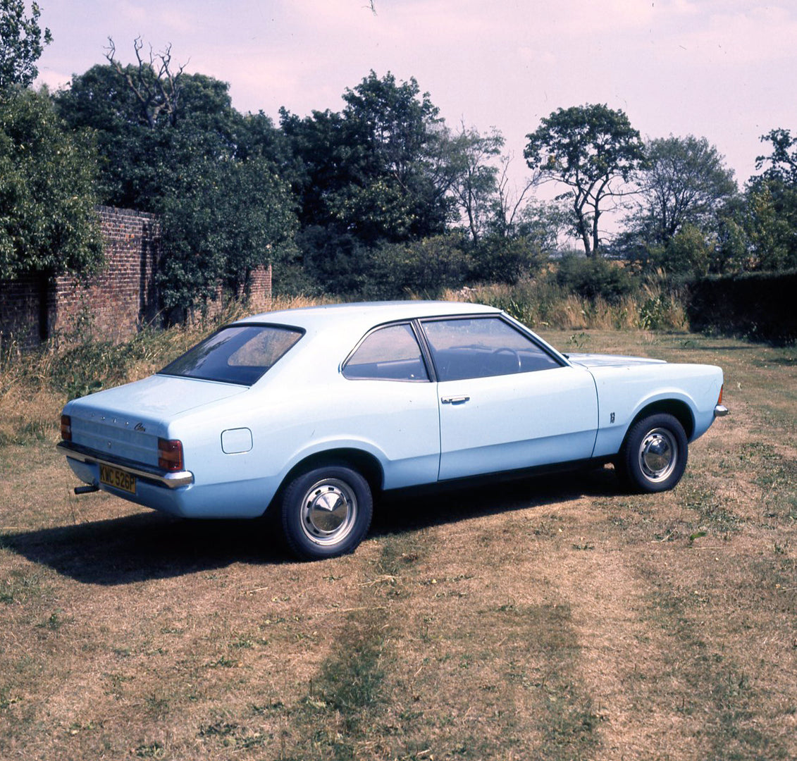 This archival image documents the 1975 Ford Cortina 1.3 Base MK III 2 door rear view in scenic field with trees and is preserved in the Ford Heritage Vault as part of Ford Motor Company's historic photographic archive. Free for personal, non-comme...
