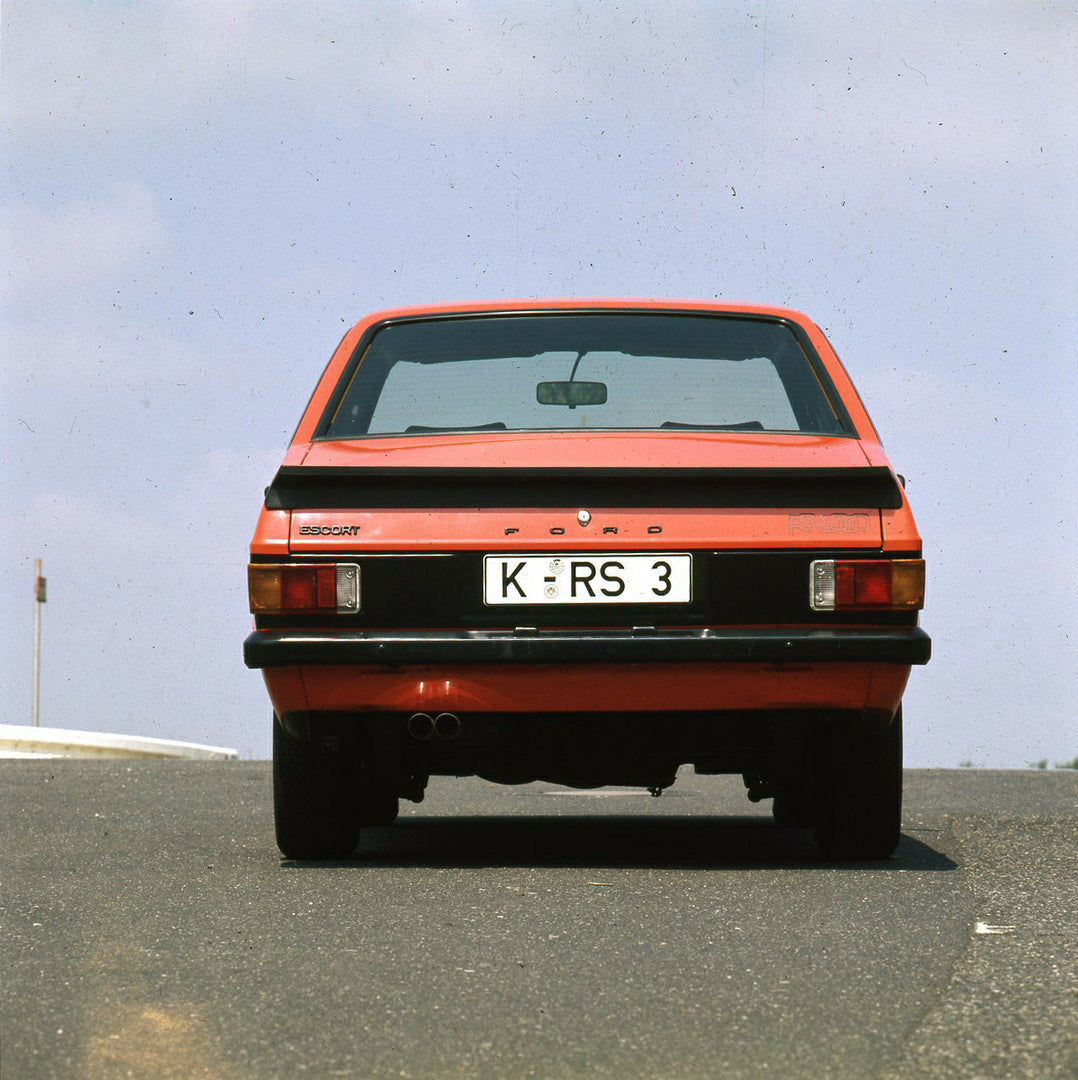 This archival image documents the 1975 Ford Escort Mark II RS 2000 rear view with scenic sky and is preserved in the Ford Heritage Vault as part of Ford Motor Company's historic photographic archive. Free for personal, non-commercial use. Ford Her...