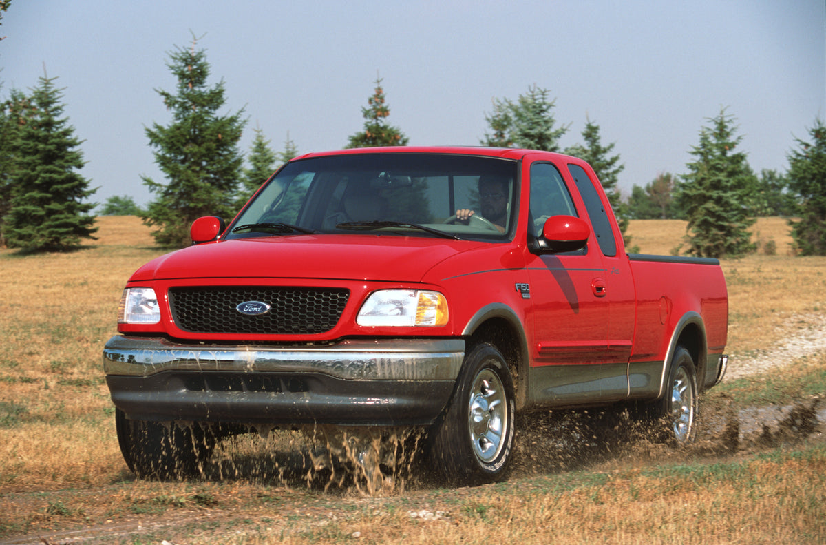 This archival image documents the 2002 Ford F-150 pickup truck scenic and is preserved in the Ford Heritage Vault as part of Ford Motor Company's historic photographic archive. Free for personal, non-commercial use. Ford Heritage Vault reference A...