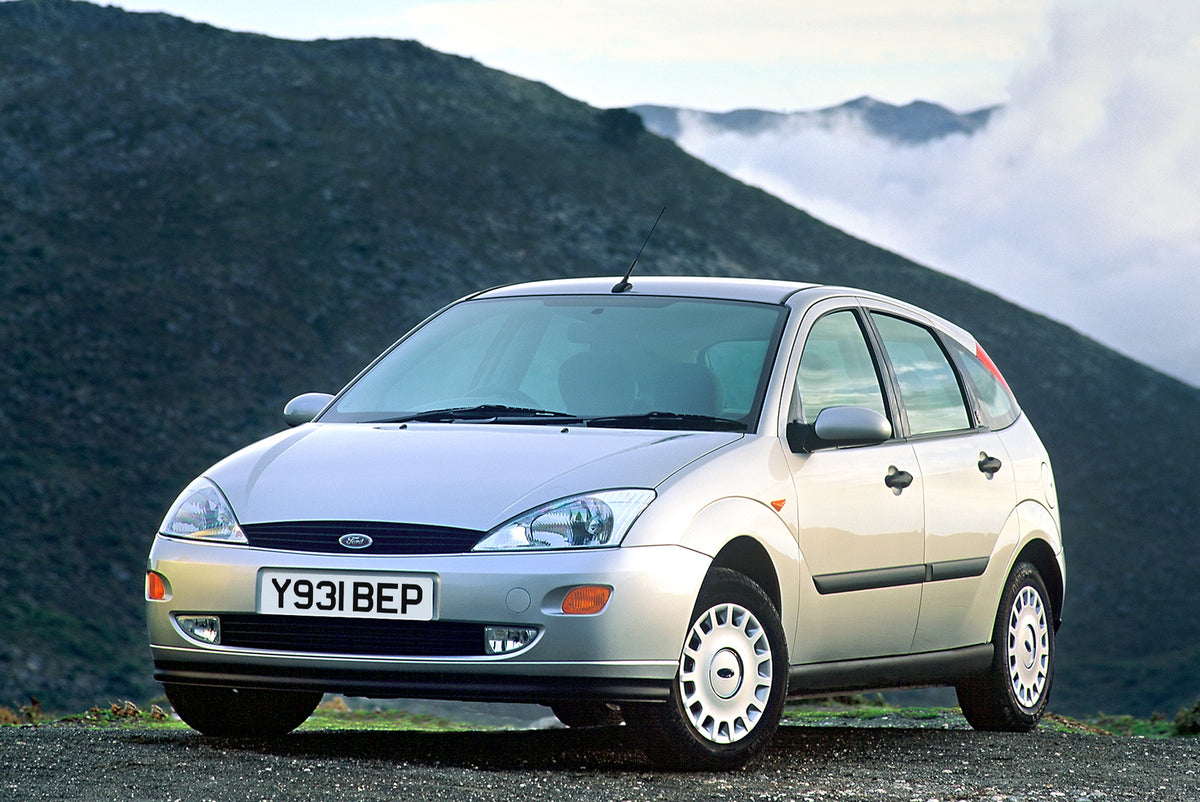 This archival image documents the 2001 Ford Focus Mark I with scenic mountain and is preserved in the Ford Heritage Vault as part of Ford Motor Company's historic photographic archive. Free for personal, non-commercial use. Ford Heritage Vault ref...