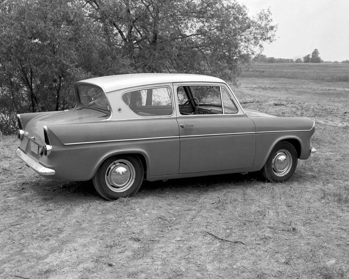 This archival image documents the 1960 Ford Anglia rear view in scenic field with trees (115267-18) and is preserved in the Ford Heritage Vault as part of Ford Motor Company's historic photographic archive. Free for personal, non-commercial use. F...