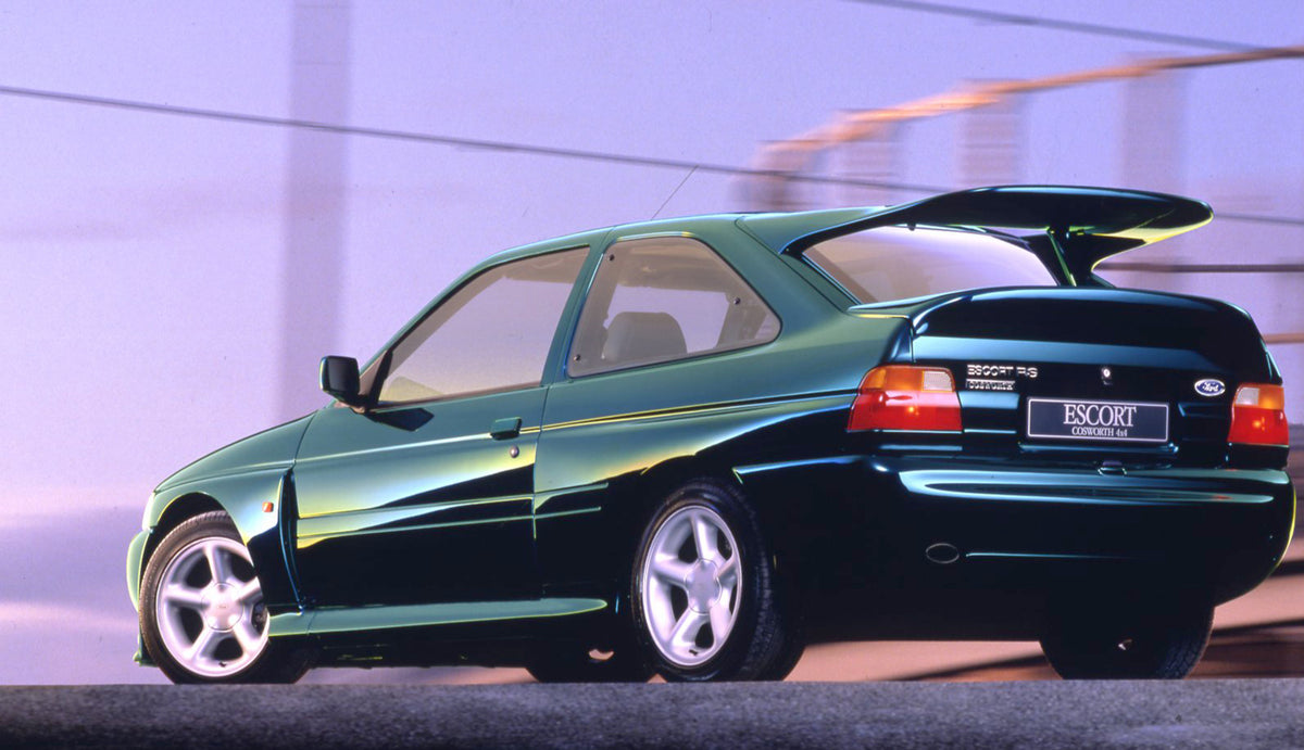 This archival image documents the 1993 Ford Escort Mark V RS Cosworth 4x4 rear view with scenic background and is preserved in the Ford Heritage Vault as part of Ford Motor Company's historic photographic archive. Free for personal, non-commercial...