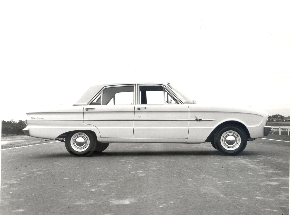 This archival image documents the 1962 Ford XL Falcon side view on scenic road and is preserved in the Ford Heritage Vault as part of Ford Motor Company's historic photographic archive. Free for personal, non-commercial use. Ford Heritage Vault re...