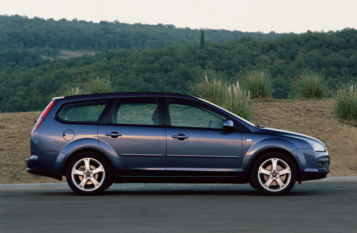 This archival image documents the 2000 Ford Focus side view on scenic road MS43107 and is preserved in the Ford Heritage Vault as part of Ford Motor Company's historic photographic archive. Free for personal, non-commercial use. Ford Heritage Vaul...