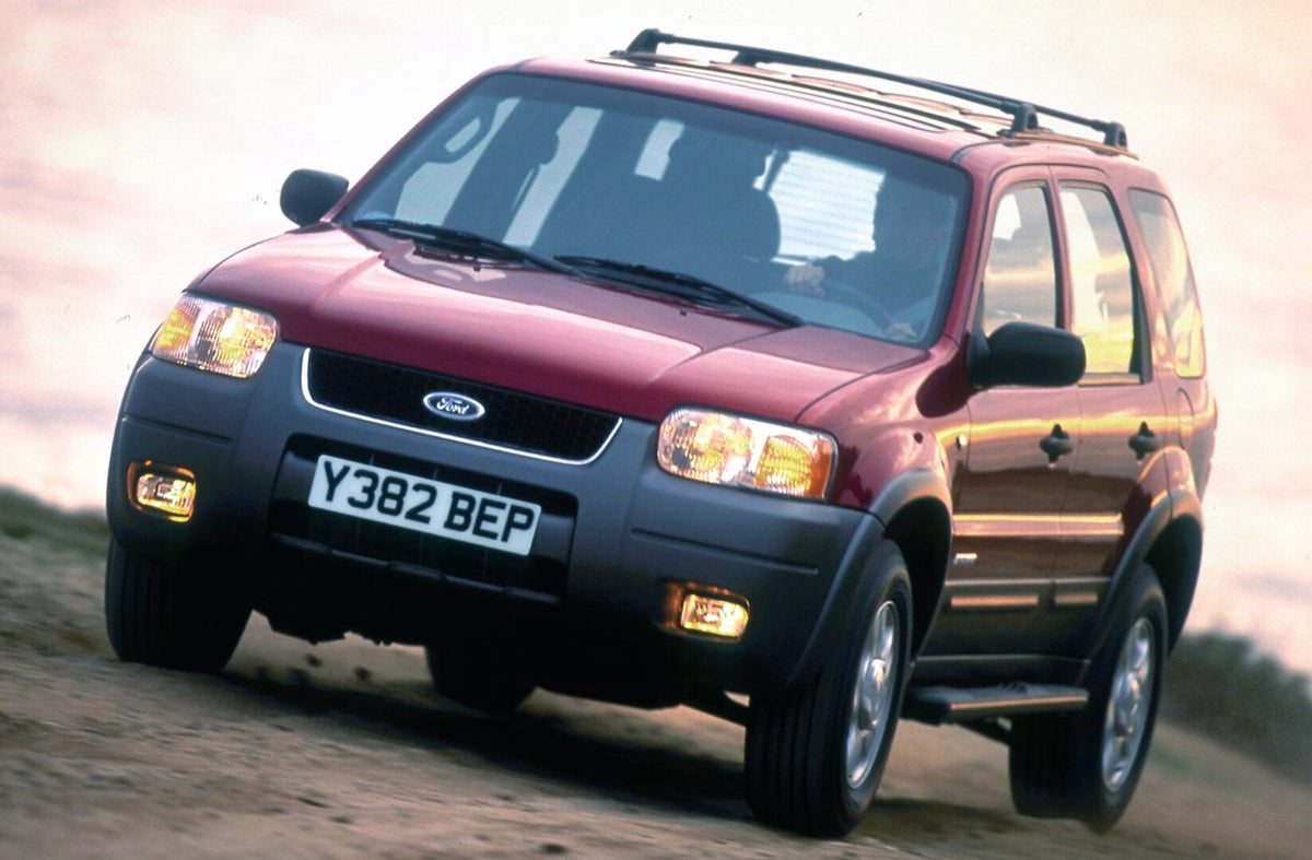 This archival image documents the 2001 Ford Maverick closeup on scenic beach and is preserved in the Ford Heritage Vault as part of Ford Motor Company's historic photographic archive. Free for personal, non-commercial use. Ford Heritage Vault refe...