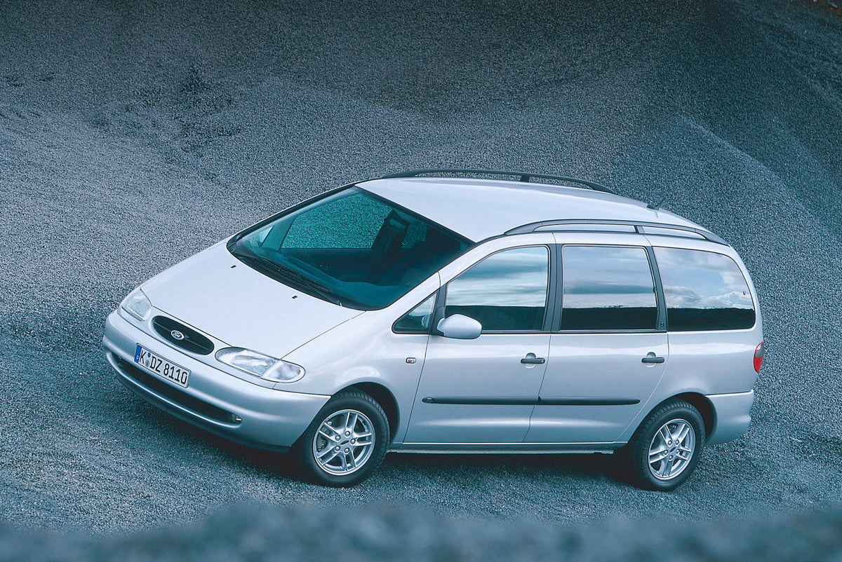 This archival image documents the 1999 Ford Galaxy aerial view on scenic gravel road and is preserved in the Ford Heritage Vault as part of Ford Motor Company's historic photographic archive. Free for personal, non-commercial use. Ford Heritage Va...