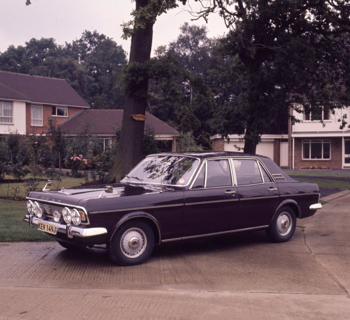 This archival image documents the 1970 Ford Zodiac Mark IV Executive on scenic street with houses and trees and is preserved in the Ford Heritage Vault as part of Ford Motor Company's historic photographic archive. Free for personal, non-commercia...