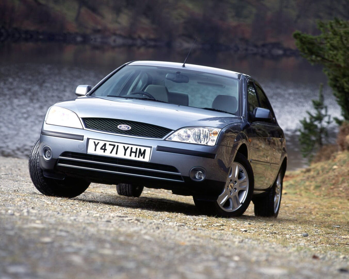 This archival image documents the 2001 Ford Mondeo Mark II Ghia front view closeup with scenic lake and is preserved in the Ford Heritage Vault as part of Ford Motor Company's historic photographic archive. Free for personal, non-commercial use. F...