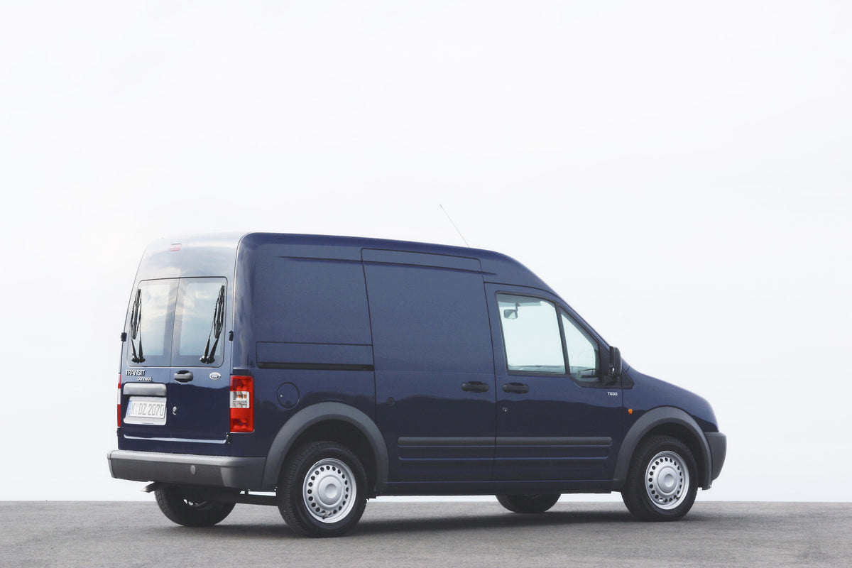 This archival image documents the 2002 Ford Transit Connect side view with scenic cloudy sky and is preserved in the Ford Heritage Vault as part of Ford Motor Company's historic photographic archive. Free for personal, non-commercial use. Ford Her...