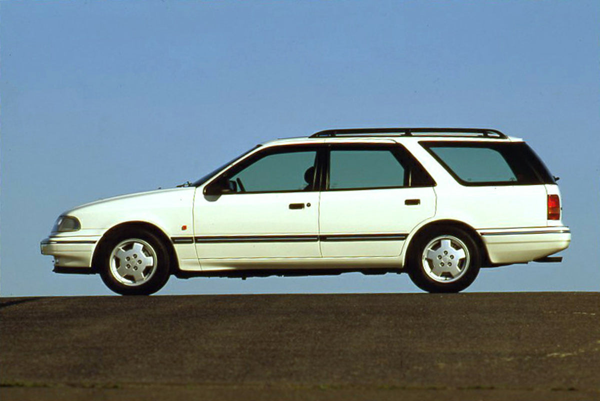 This archival image documents the 1993 Ford Scorpio Mark I GLX 24v Wagon side view with scenic blue sky and is preserved in the Ford Heritage Vault as part of Ford Motor Company's historic photographic archive. Free for personal, non-commercial us...