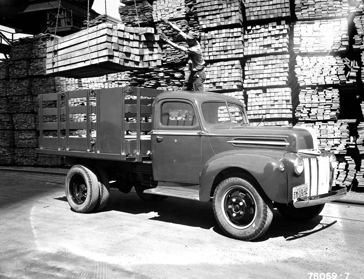 This archival image documents the 1942 Ford Heavy-Duty Regular proto stake truck at work and is preserved in the Ford Heritage Vault as part of Ford Motor Company's historic photographic archive. Free for personal, non-commercial use. Ford Heritag...