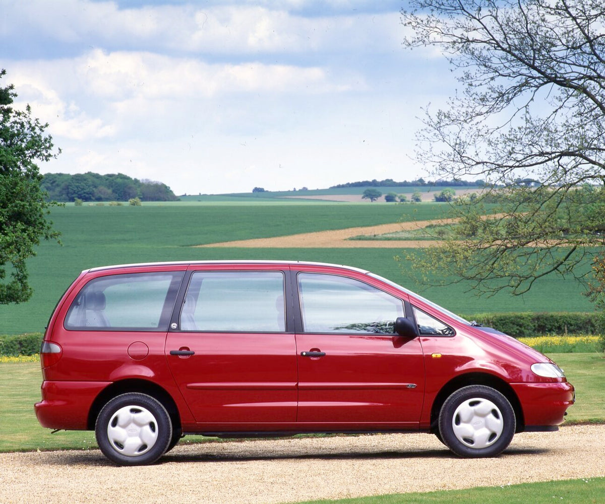 This archival image documents the 1995 Ford Galaxy GLX RHD side view on road with scenic field and is preserved in the Ford Heritage Vault as part of Ford Motor Company's historic photographic archive. Free for personal, non-commercial use. Ford H...