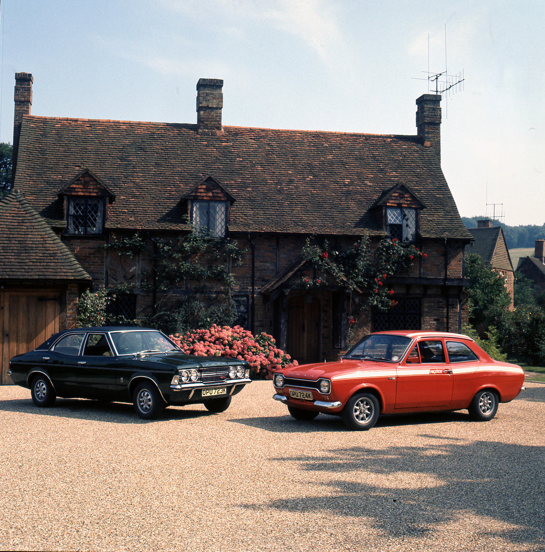 This archival image documents the 1971 Escort Mexico Mark I and Cortina 2000 GXL 4 Door in front of scenic home and is preserved in the Ford Heritage Vault as part of Ford Motor Company's historic photographic archive. Free for personal, non-comme...