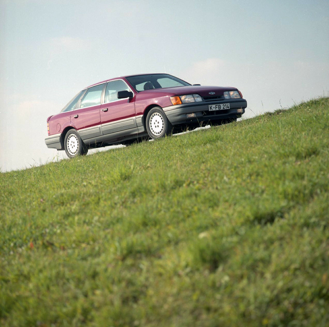 This archival image documents the 1986 Merkur Scorpio low view on scenic road in Cologne and is preserved in the Ford Heritage Vault as part of Ford Motor Company's historic photographic archive. Free for personal, non-commercial use. Ford Heritag...