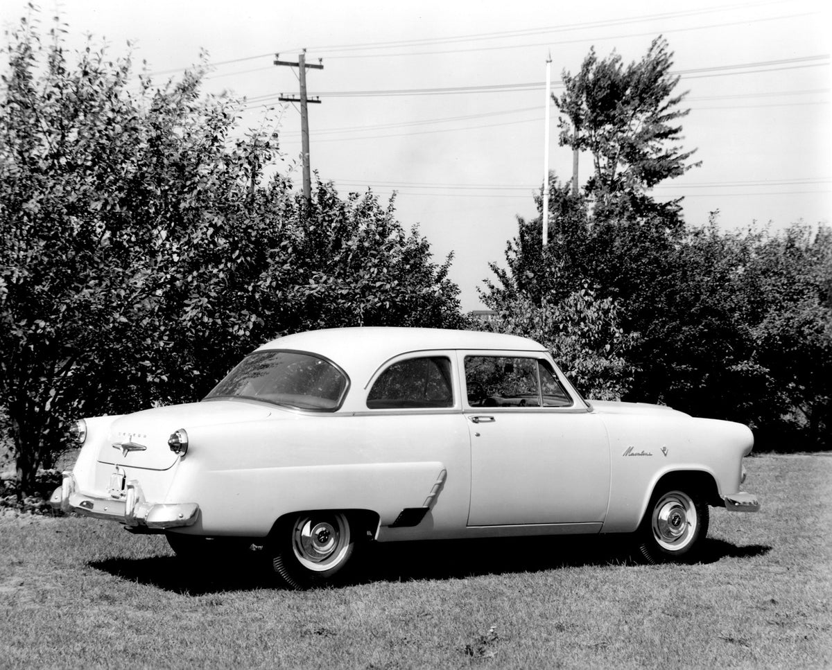 This archival image documents the 1952 Meteor Mainline Coupe rear view with scenic trees AR-2007-5 and is preserved in the Ford Heritage Vault as part of Ford Motor Company's historic photographic archive. Free for personal, non-commercial use. Fo...