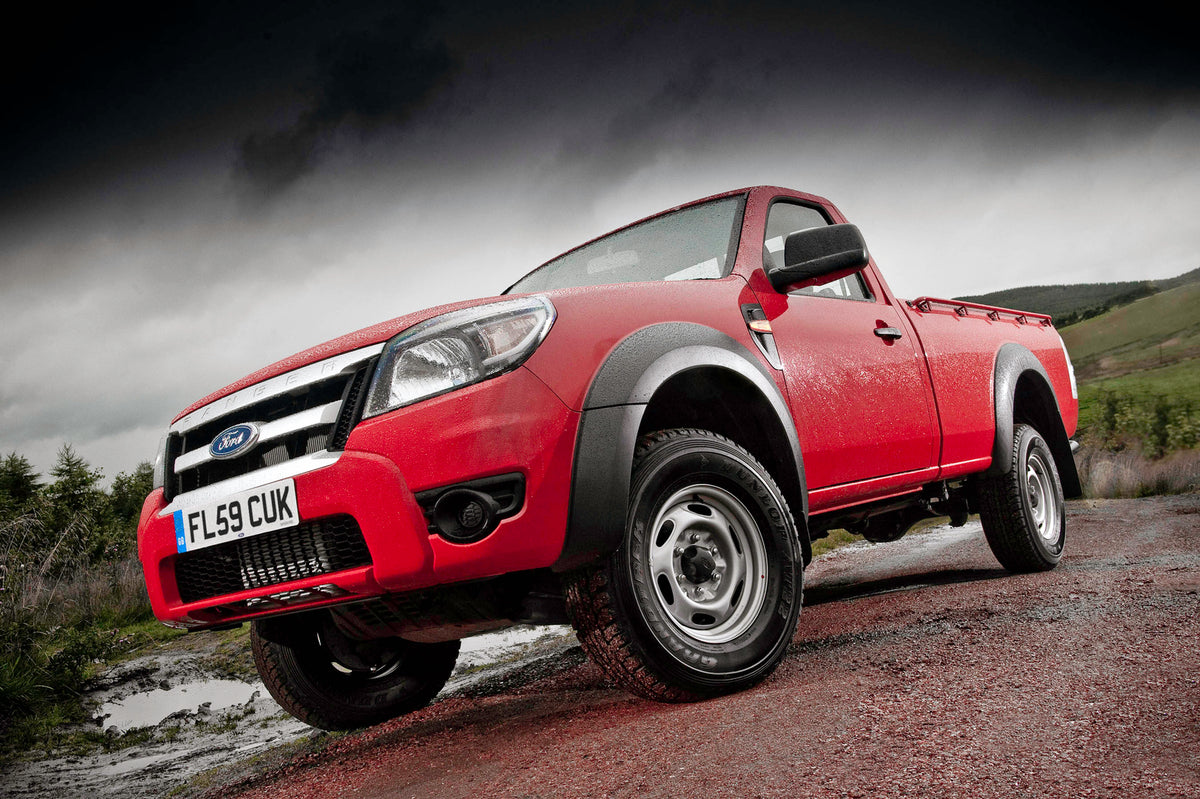 This archival image documents the 2009 Ford Ranger low view on scenic dirt road and is preserved in the Ford Heritage Vault as part of Ford Motor Company's historic photographic archive. Free for personal, non-commercial use. Ford Heritage Vault r...