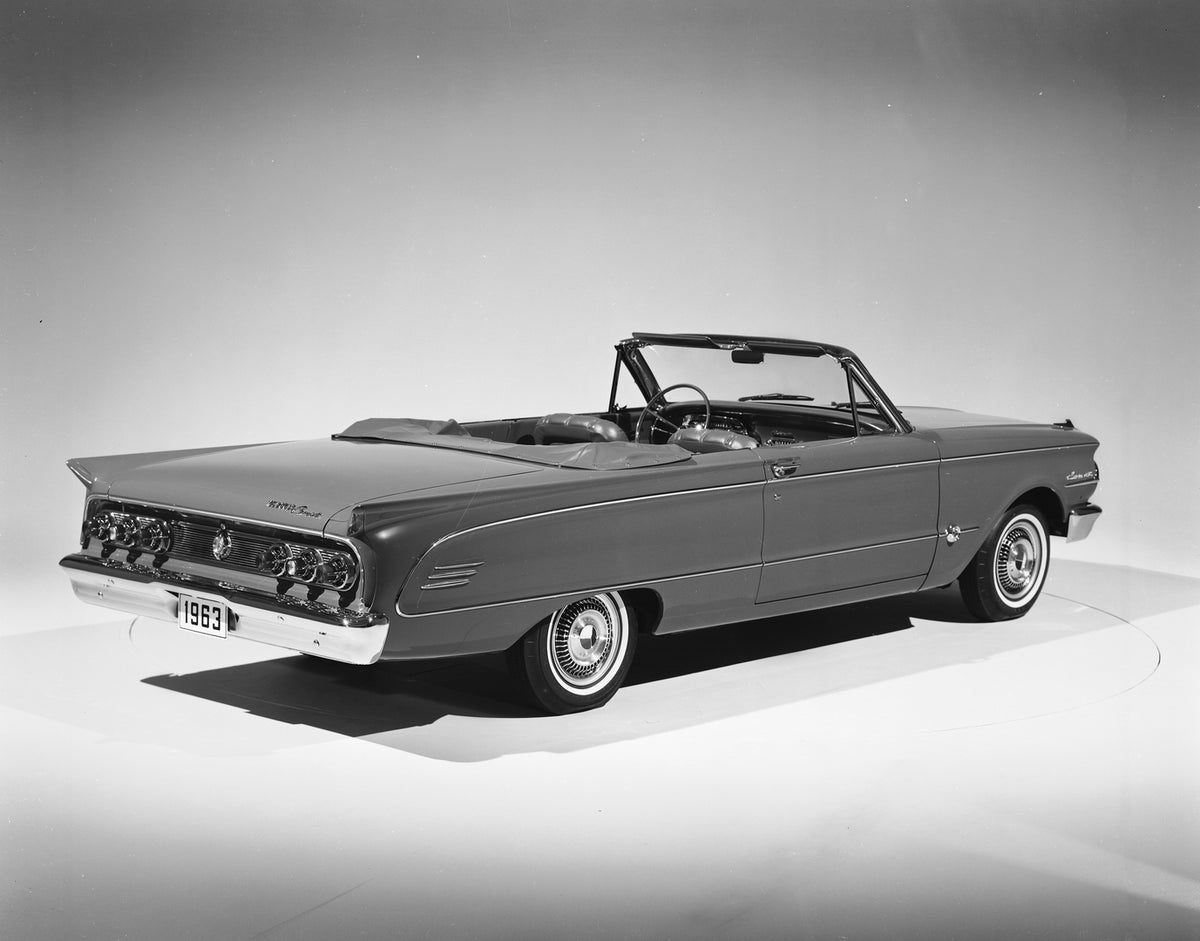 This archival image documents the 1963 Mercury Comet S-22 convertible with Top Down and is preserved in the Ford Heritage Vault as part of Ford Motor Company's historic photographic archive. Free for personal, non-commercial use. Ford Heritage Vau...