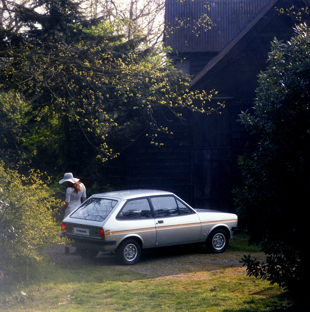 This archival image documents the 1976 Ford Fiesta Mark Mark I Ghia S rear view with scenic cabin and model and is preserved in the Ford Heritage Vault as part of Ford Motor Company's historic photographic archive. Free for personal, non-commercia...