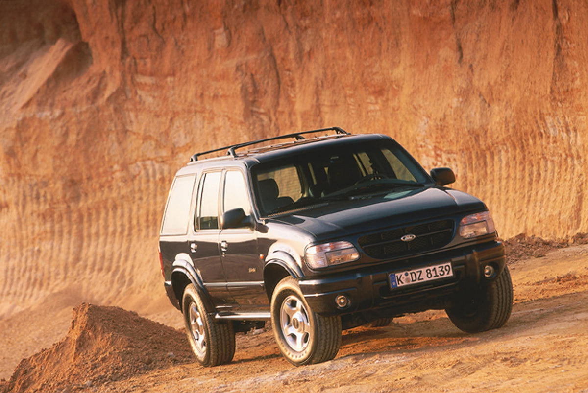 This archival image documents the 2001 Ford Explorer with scenic rock formation and is preserved in the Ford Heritage Vault as part of Ford Motor Company's historic photographic archive. Free for personal, non-commercial use. Ford Heritage Vault r...