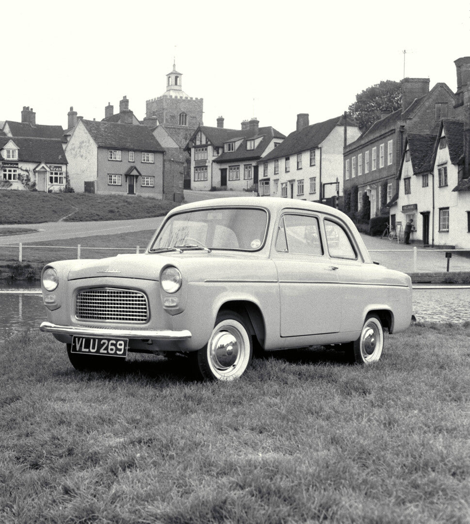 This archival image documents the 1959 Ford Popular 100E front 3/4 view in scenic town and is preserved in the Ford Heritage Vault as part of Ford Motor Company's historic photographic archive. Free for personal, non-commercial use. Ford Heritage ...