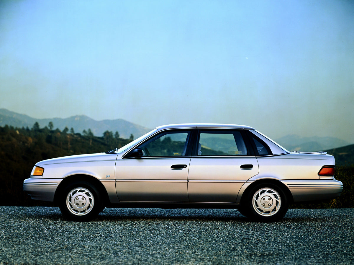 This archival image documents the 1991 Ford Taurus four-door and is preserved in the Ford Heritage Vault as part of Ford Motor Company's historic photographic archive. Free for personal, non-commercial use. Ford Heritage Vault reference AR-2001-94...