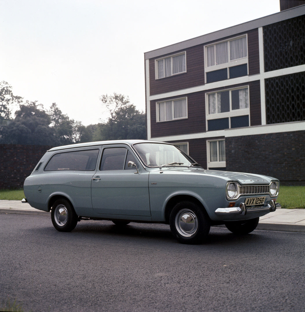 This archival image documents the 1968 Ford Escort Mark I Estate in front of building with scenic trees and is preserved in the Ford Heritage Vault as part of Ford Motor Company's historic photographic archive. Free for personal, non-commercial us...