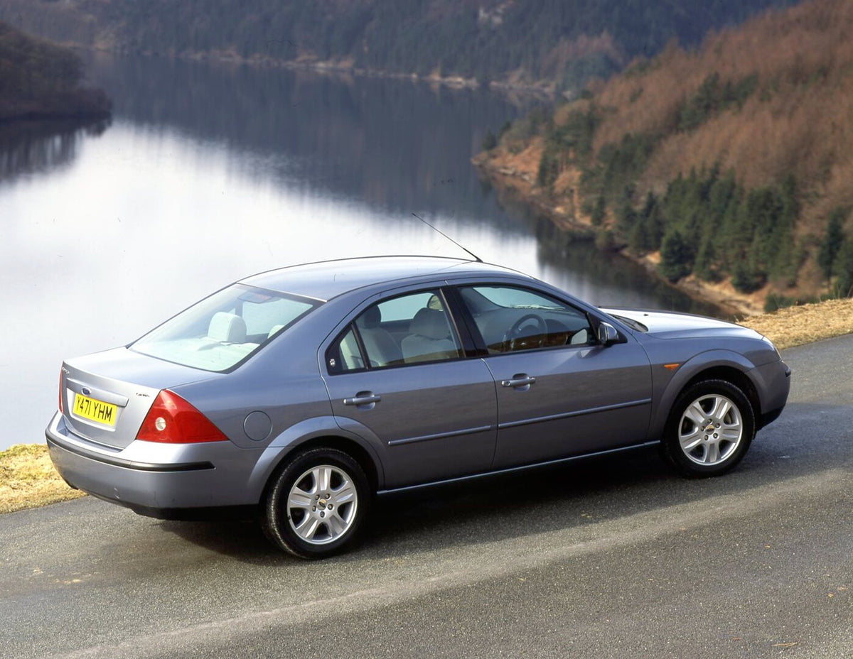 This archival image documents the 2001 Ford Mondeo Mark II Ghia rear view on scenic road overlooking lake and is preserved in the Ford Heritage Vault as part of Ford Motor Company's historic photographic archive. Free for personal, non-commercial ...